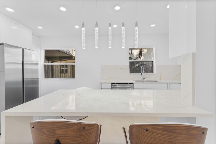 Gorgeous, fully upgraded 1st-floor condo in Kings Point! 2 beds, 2 baths with bright, open kitchen featuring Calacatta quartz, white cabinets, and stainless steel appliances. Elegant tile in living/kitchen, laminate in bedrooms. Includes in-unit washer/dryer. HOA $900/month covers basic cable; $2,000 one-time capital contribution. No rentals first 2 years. Enjoy vibrant community amenities and an active, social lifestyle!