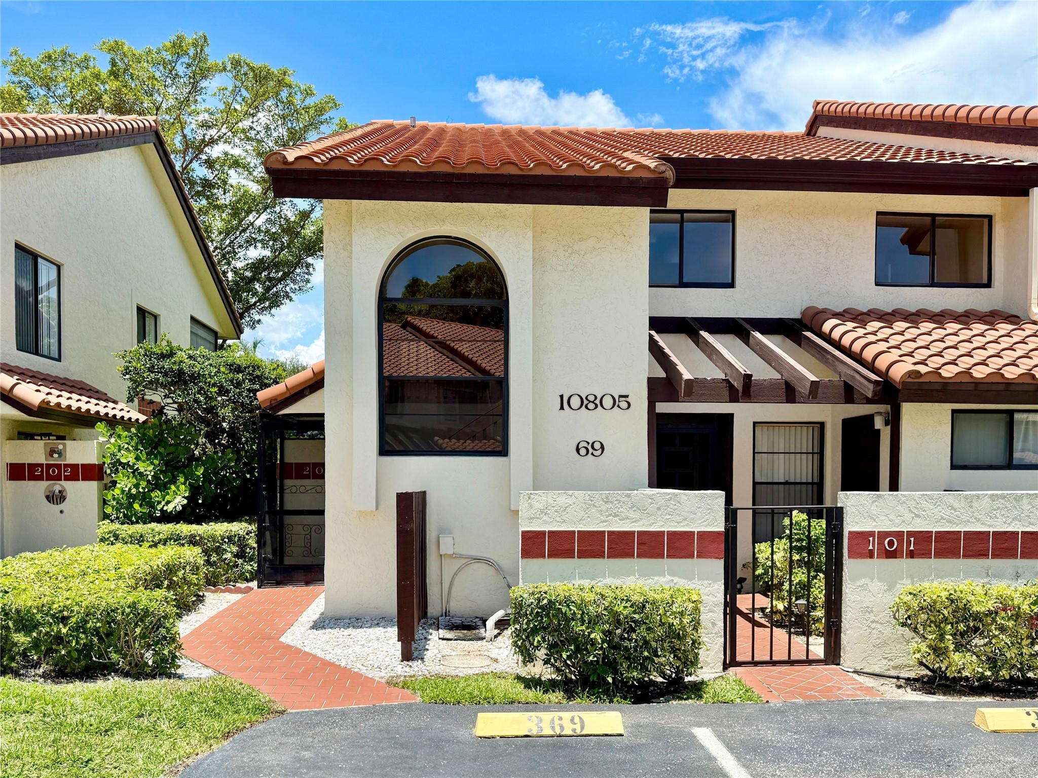 Amazing Price and Beautifully Maintained!! True 3-Bedroom and 2-Bath Corner Unit. Open Concept Living/Dining Room with Vaulted Ceilings and Plenty of Natural Light. Enjoy Private and Relaxing Water Views of the Canal on the Spacious Screened Lanai with Shutters. Bright Eat-in Kitchen w/ Pantry, Snack Bar & Newer Bosch Dishwasher. Master Bedroom Suite has (2) Closets & Slider to Porch. Master Bath w/Kohler Walk-in Bath/Shower. Laminate Flooring & New Carpet in all 3 Bedrooms & Stairs. New A/C & Water Heater (2024). Huge Extra Attic Storage w/Pull Down Stairs. Clubhouse Includes Olympic Size Temperature-Controlled (Heated/Cooled) Pool, Hot Tub, Fitness Rooms, Card Rooms, Billiards, Pickleball & More. (2) Assigned Parking Spaces. Strong Reserves. 55+ Active Community. ESA Animals Welcome!