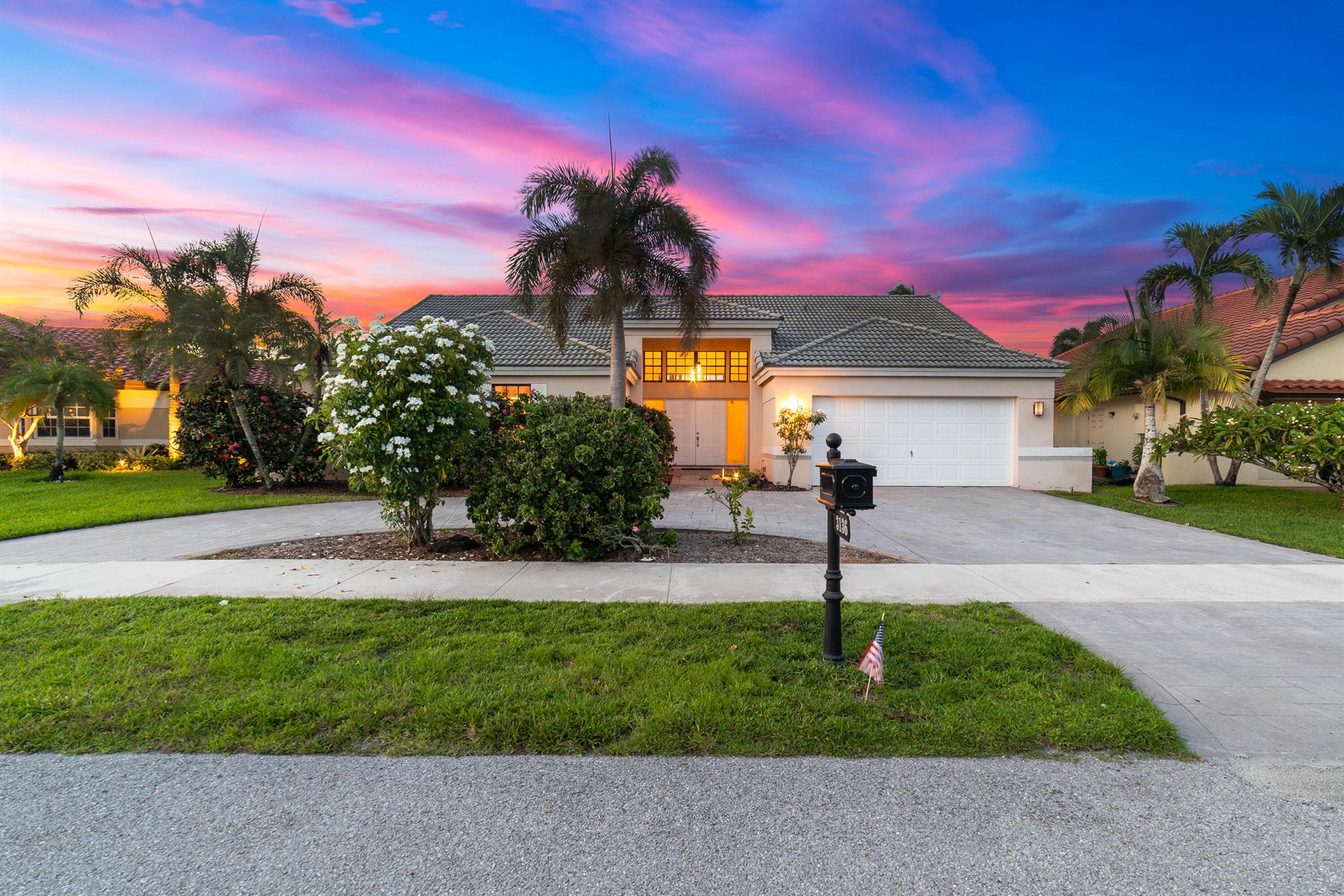 Enter into modern elegance in this 4-bedroom, 2-bathroom residence nestled in the highly sought-after Forest Ridge community of Davie. From the moment you arrive, the grand roundabout driveway and 2-car garage set the tone for this sophisticated home. Inside, soaring vaulted ceilings and an airy open-concept layout create a bright and inviting atmosphere. The expansive living and family room areas flow effortlessly into the updated flooring and modern finishes throughout. The spacious primary suite offers a tranquil retreat, featuring tray ceilings and a partially updated en-suite bath. Head outside to your private oasis with an oversized covered patio overlooking a serene canal lined with mature mango, lychee trees, and vibrant flowering cacti.