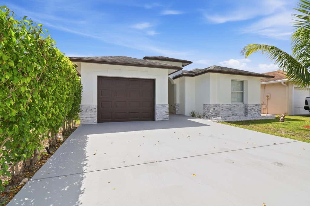Photo of 105 Vanessa Street, Palm Springs, FL 33461 (MLS # B26063905)