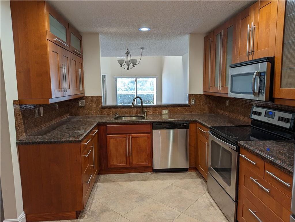 Photo of 7374 NW 61st Terrace, Parkland, FL 33067 (MLS # B26022212)