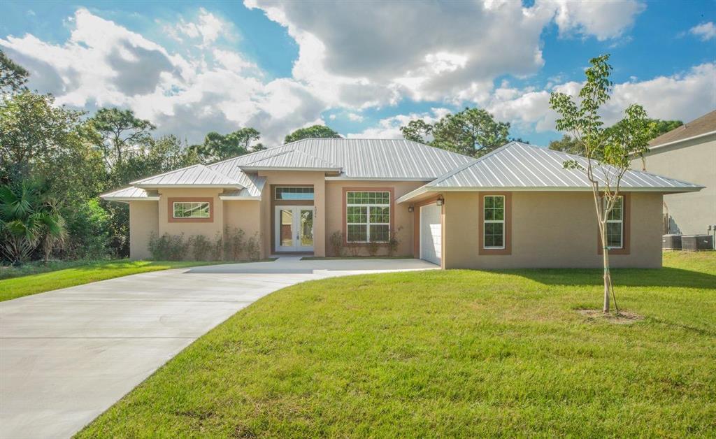 CHECK OUT THIS STUNNING, BRAND NEW 3 BEDROOM CBS HOME. UPGRADES INCLUDE: METAL ROOF, 6x24IN. PORCELAIN TILE THROUGH-OUT (REGARD WATERPROOFING & CRACK PROTECTIVE MEMBRANE INSTALLED THROUGHOUT) RIVER ROCK INSTALLED IN SHOWERS, 42 IN WOOD CABINETS W/ SOFT CLOSING DOORS AND DRAWERS, 3CM GRANITE COUNTERTOPS, OVERSIZED DRIVEWAY, AWP US ENERGY IMPACT WINDOWS AND DOORS, SPRAYED R-30 INSULATION IN CEILING, FRIGIDAIRE STAINLESS STEEL APPLIANCES WITH UPGRADED CHEF COOK TOP, VENT AND FAUCET, WALL MICROWAVE AND OVEN, PUSH BUTTON GARBAGE DISPOSAL, CLOSE TO THE TURNPIKE AND 95