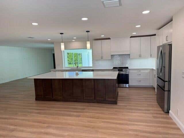 Photo of 10736 Locust Street, Palm Beach Gardens, FL 33418 (MLS # B26045006)