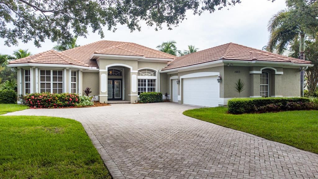 Photo of 1683 SW Foxpoint Trail Trail, Palm City, FL 34990 (MLS # R10737027)