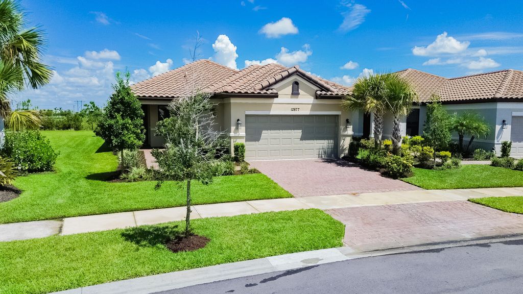 Photo of 12877 SW Ambra Street, Port Saint Lucie, FL 34987 (MLS # B26050654)