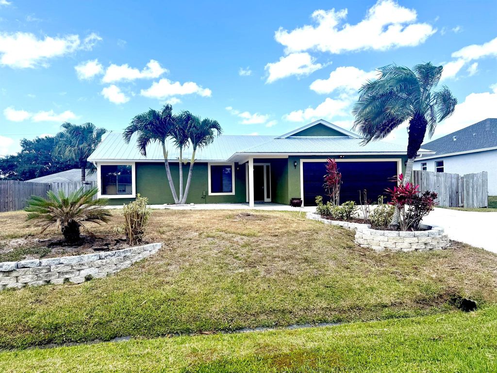 Photo of 1355 SW Granville Avenue, Port Saint Lucie, FL 34953 (MLS # R11073830)