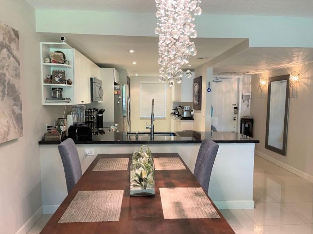 Photo of 550 Oaks Lane #204, Pompano Beach, FL 33069 (MLS # R10788053)