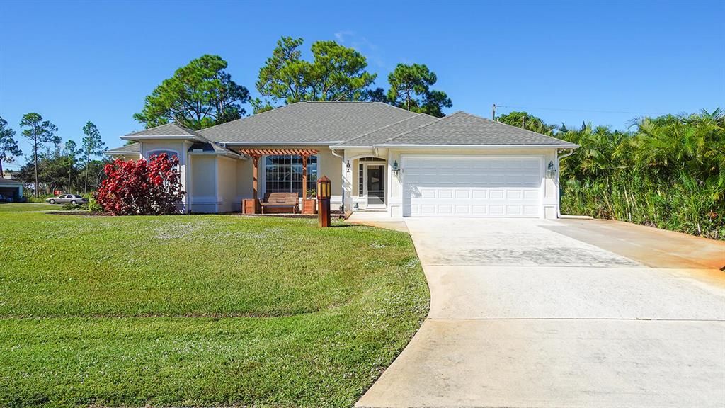 Photo of 102 NW Peach Street, Port Saint Lucie, FL 34983 (MLS # R10756725)