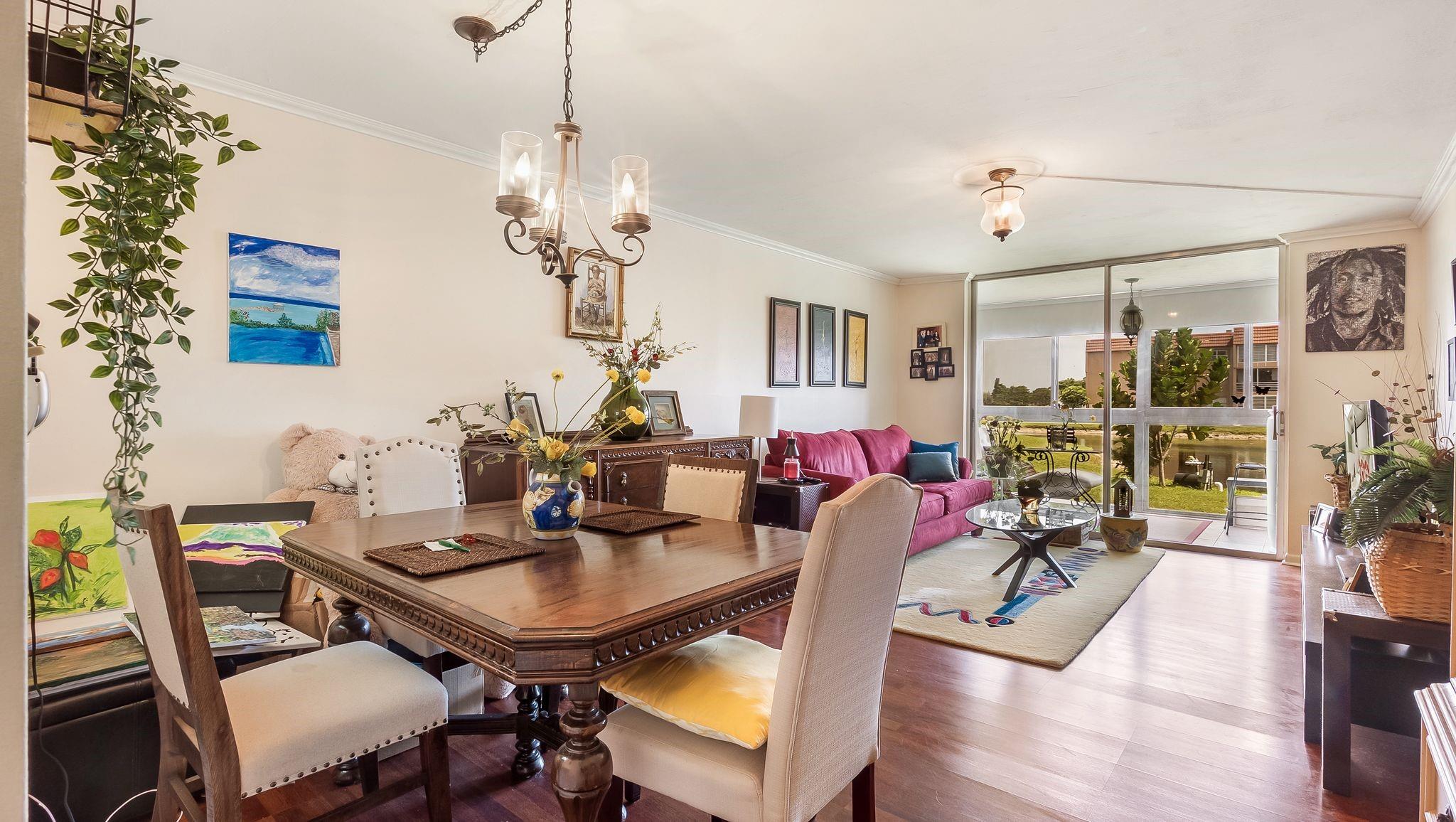 This inviting one-bedroom is a true gem, offering a peaceful retreat with both style and comfort in a 55+ community. Beautiful wood flooring stretches across the room, adding a touch of warmth and sophistication. Natural light pours in through large impact windows, which not only offer storm protection and energy efficiency but also frame a stunning water view from the back of the home. Whether it’s morning sunlight reflecting off the water or the calm glow at sunset, the view provides a tranquil backdrop that elevates the everyday living experience. This light-filled space is perfect for unwinding and enjoying the beauty just outside your window.