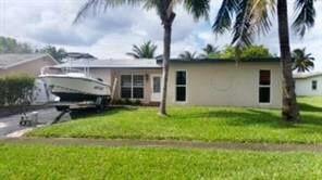 Great Location. Nicely updated home on waterfront canal lot. Home Features Spacious Open Floor Plan With Split Bedrooms, Updated New Kitchen and Appliances, Granite Countertops, Tile and Wood Flooring Throughout, Impact Windows, Screened Patio, Large Fenced Yard. Excellent Location, Minutes to All Shopping, Restaurants, Sawgrass Mall and Interstates. Very Nice Home In great location. Tenant occupied til end of September Showings and Occupancy available after October 1st. Shown by appointment. Please use show assist. Please see Broker Remarks.