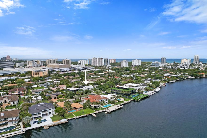 Located in gated, Sunrise Intracoastal, this renovated California-style estate sits on an oversized lot. A 20ft foyer leads to a chef's kitchen with JennAir gas appliances, custom millwork cabinetry, and double dishwashers. Entertain by the 8ft gas fireplace, built-in bar, or the glass-encased wine room.  The primary suite features vaulted ceilings and a spa-bath with a soaking tub. Outside, a $200K+ renovation includes a two-story screen enclosure, 2025 thatch Tikis, and a pool with a 10ft waterfall/fire feature. Highlights: impact glass, 2019 roof, 3 zone American Standard A/Cs, and two laundry rooms. Luxury living behind Galleria Mall.