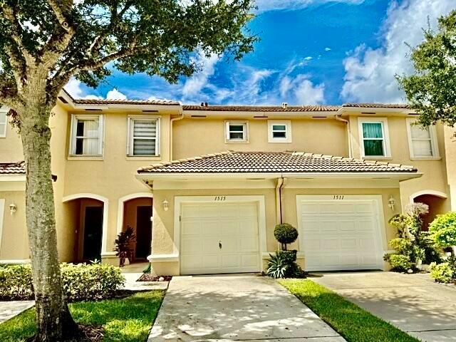 Major price reduction!! Such a beautiful, move-in ready all ages TH in Wellington. Hurricane protection. OPEN, light and bright, white kitchen with SS appliances with large countertop, great for entertaining and for bar stools. Pantry included. Coffee/liquor bar.  Gorgeous tile floors on the first floor. Half bath on the first floor for guests. Newer luxury window treatments. Screened patio with storage. Second floor loft/home office/playroom/exercise room. Guest bedroom could have private bathroom. The primary suite is bright and large. White and bright bathroom, double sinks, shower with window. Pet friendly community. Low maintenance. Short walk to pool. Easy access to all that is Wellington.