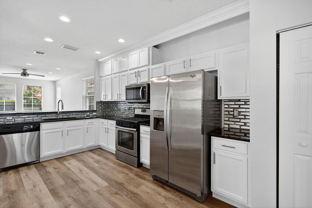 Photo of 318 September Street, Palm Beach Gardens, FL 33410 (MLS # B26009888)