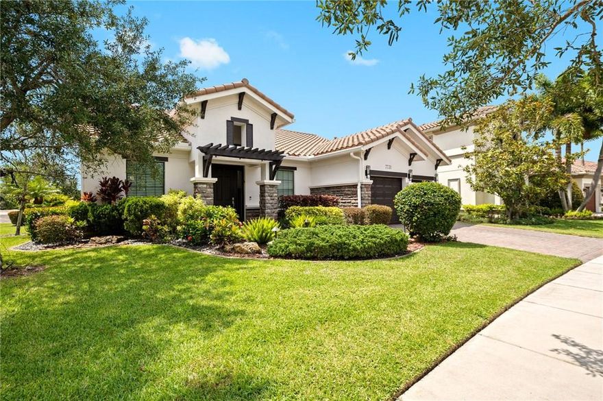 Stunning 2-story, 4 bedroom, 3 bath home located in Parkland Golf and CC. Primary bedroom on 1st floor. 4th bedroom converted to home gym. Water view on the 18th fairway. Recently remodeled gourmet kitchen w/custom wood cabinets, quartz countertops, built in bar w/beverage center & stainless steel appliances, including a double oven. Saturnia marble & engineered hardwood floors. Custom window treatments & impact glass throughout. Custom closets. Whole house generator. Exterior recently painted with new light fixtures. Extra-deep garage with epoxy floor & custom workbench w/built-in cabinetry. Summer kitchen with built-in infrared BBQ & motorized screened-in patio. Best location in Parkland Golf with short walk to amenities. Enjoy access to golf, tennis, pickleball, restaurants, and pools.