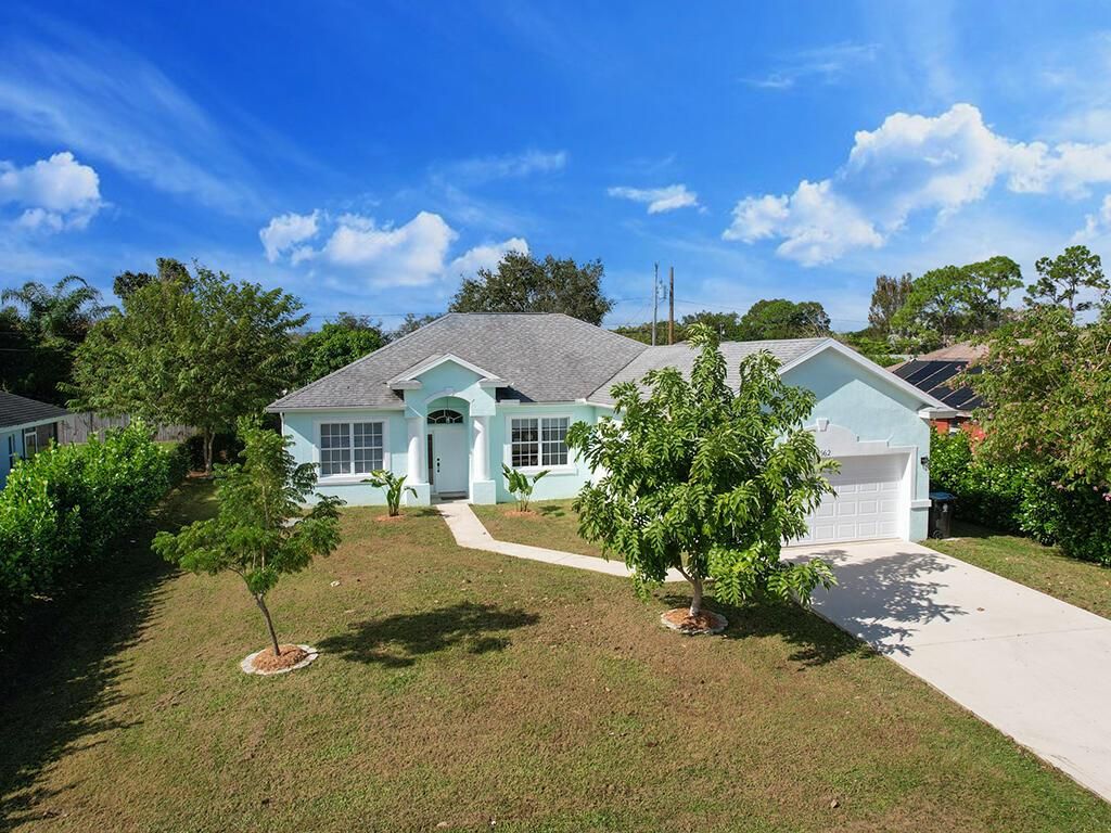 Photo of 3562 SW Vollmer Street, Port Saint Lucie, FL 34953 (MLS # R10940395)