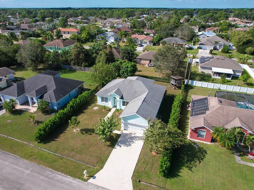 Photo of 3562 SW Vollmer Street, Port Saint Lucie, FL 34953 (MLS # R10940395)