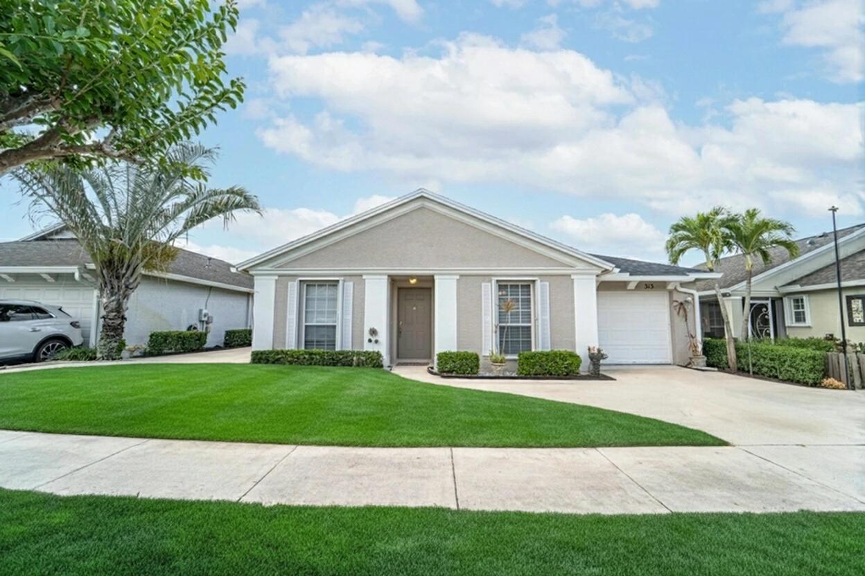BACK ON THE MARKET! Buyer Financing fell through, their loss is your GAIN! Enjoy LAKEFRONT LIVING in this beautiful gated community conveniently located in St. Lucie West! Low HOA includes a resort style pool, spa, fitness center, playground & more! This 2 bedroom, 2 bath, 1 car garage home in Lake Forest has an open layout with tile and laminate flooring throughout. Plenty of closest space and a large screened patio overlooking the private lake. New roof installed in 2022 and newer easy to use accordion hurricane shutters. The low price HOA includes lawn service, cable, internet and access to all amenities. SELLER IS MOTIVATED! (Some photos are virtually staged).