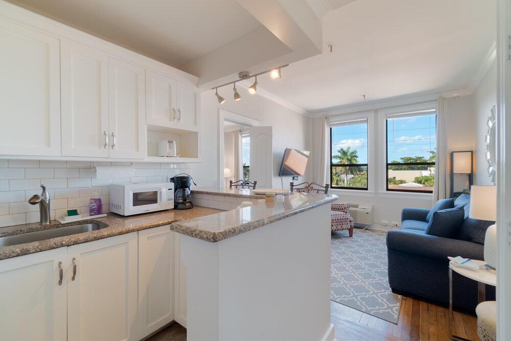Don't miss out on this Stunning Condo with Tree views and northern exposure. Located in the Historic Palm Beach Hotel on The Island of Palm Beach. Included in the HOA is 24-hour front desk, water, electric, basic cable and WIFI, trash removal, building insurance, and amenities, such as pool and gym. This historic property offers onsite laundry, bike storage, a serene covered lanai, and best of all: no rental restrictions for immediate income opportunities!!! This will not last long. Video tours also available upon request.