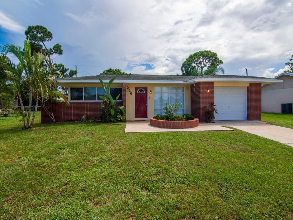 Photo of 226 SW Reynolds Avenue Ave, Port Saint Lucie, FL 34983 (MLS # R10829503)
