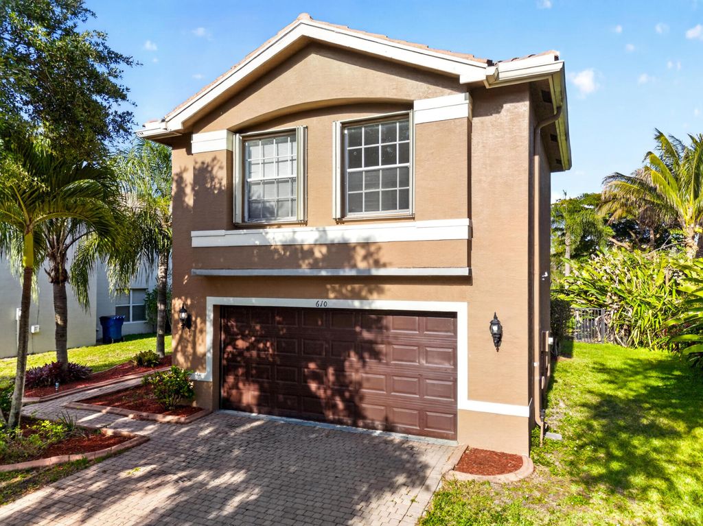 Photo of 610 Peppergrass Run, Royal Palm Beach, FL 33411 (MLS # B26022112)