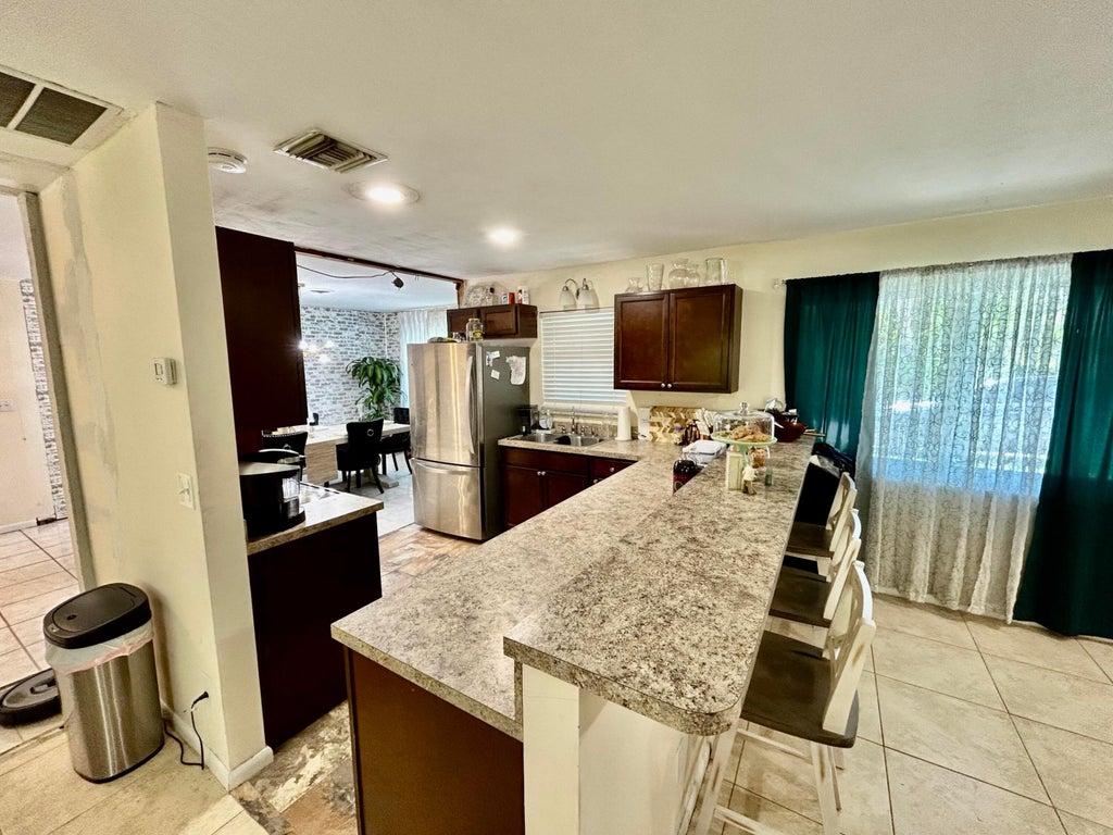 Photo of 1065 NE Banyan Tree Drive, Jensen Beach, FL 34957 (MLS # R10990524)