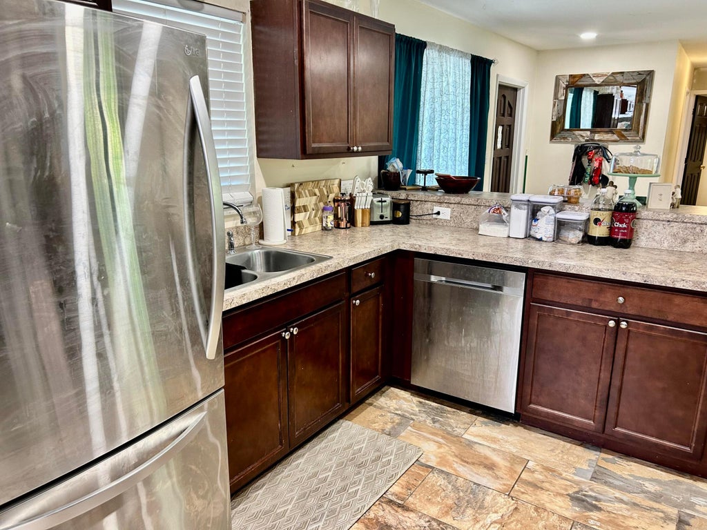 Photo of 1065 NE Banyan Tree Drive, Jensen Beach, FL 34957 (MLS # R10990524)