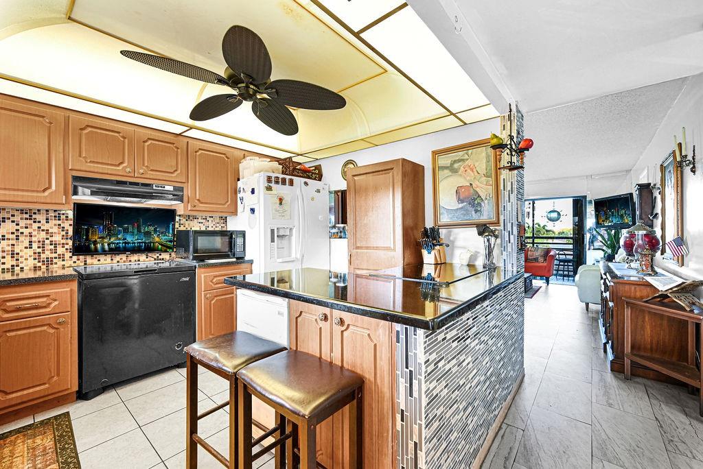 Welcome to this unique 2-bedroom, 2-bathroom corner unit on the 3rd floor, offering serene canal views from your screened balcony—perfect for relaxing and enjoying the tranquil surroundings. The upgraded kitchen features modern finishes, making it a delightful space for cooking and entertaining. The ceramic tile floors throughout the unit add a sleek and low-maintenance touch. Located in the highly desirable 55+ community of Sunrise Lake, residents have access to an abundance of amenities, including a movie theater, courtesy bus, tennis courts, golf, pools, sauna, hot tub, and much more! This unit also includes assigned parking, with plenty of guest parking available. Don't miss your chance to experience comfortable living in a vibrant, active community!