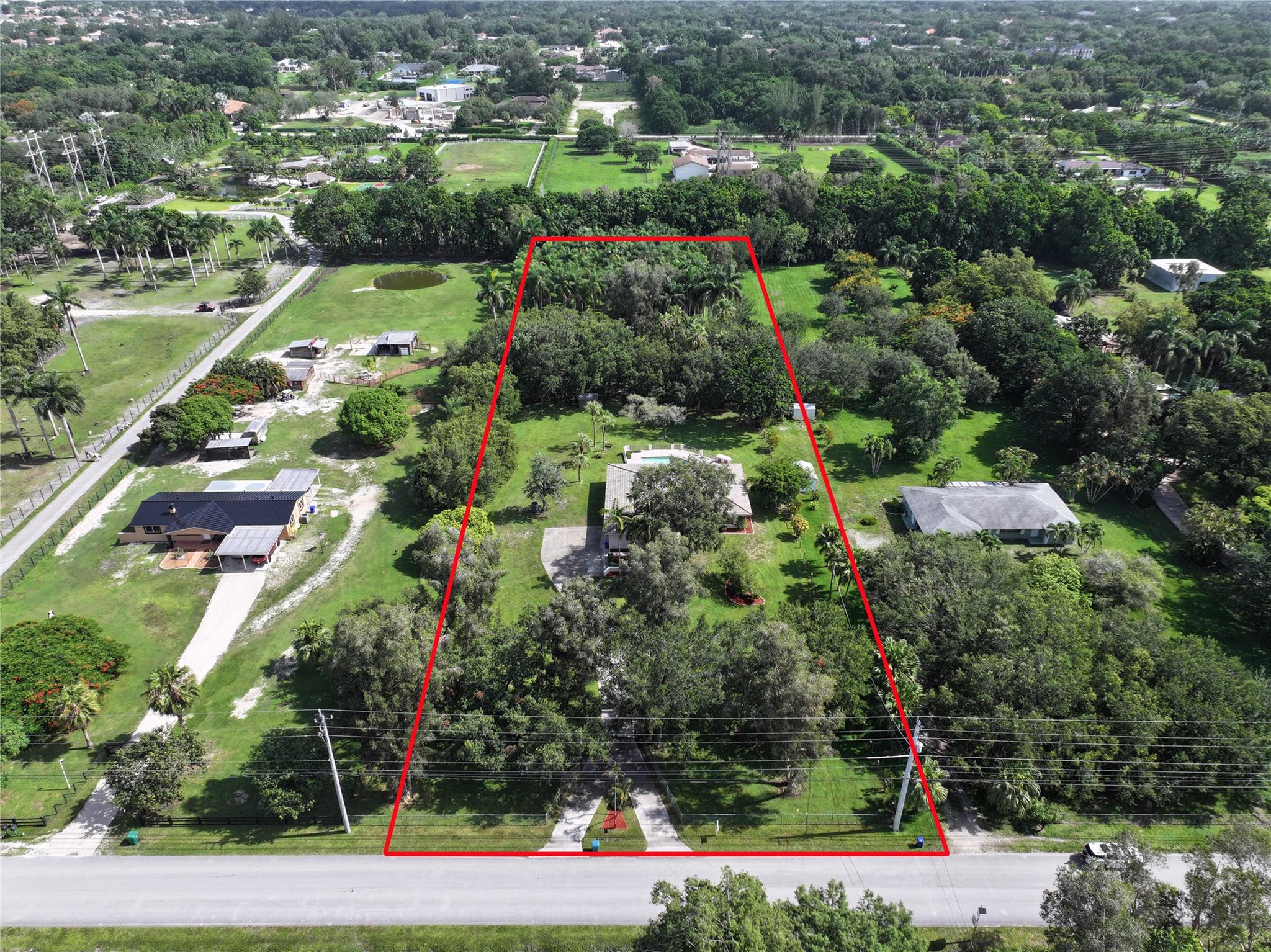 ***OPPORTUNITY IN SUNSHINE RANCHES!!!***LOOKING TO BUILD YOUR DREAM ESTATE IN THE HEART OF SUNSHINE RANCHES? LOOK NO FURTHER! THIS SPRAWLING 2.35-ACRE LOT (165' X 620') OFFERS PRIVACY & SECLUSION IN ONE OF SOUTH FLORIDA’S MOST DESIRABLE EQUESTRIAN NEIGHBORHOODS. AS THE LANDSCAPE OF SOUTHWEST RANCHES TRANSFORMS INTO WHAT'S BEING CALLED “THE HAMPTONS OF SOUTH FLORIDA,” THIS IS YOUR CHANCE TO SECURE A PRIME SPOT AMONG LUXURY ESTATES. OVER 17 HOMES—EACH OVER 20,000+ SQFT—ARE CURRENTLY BUILT, UNDER CONSTRUCTION,OR IN FOR PERMITTING. THE EXISITNG 3-BEDROOM, 2-BATH HOME W/A 2-CAR GARAGE & POOL NEEDS TO BE DEMOLISHED AND REMOVED.