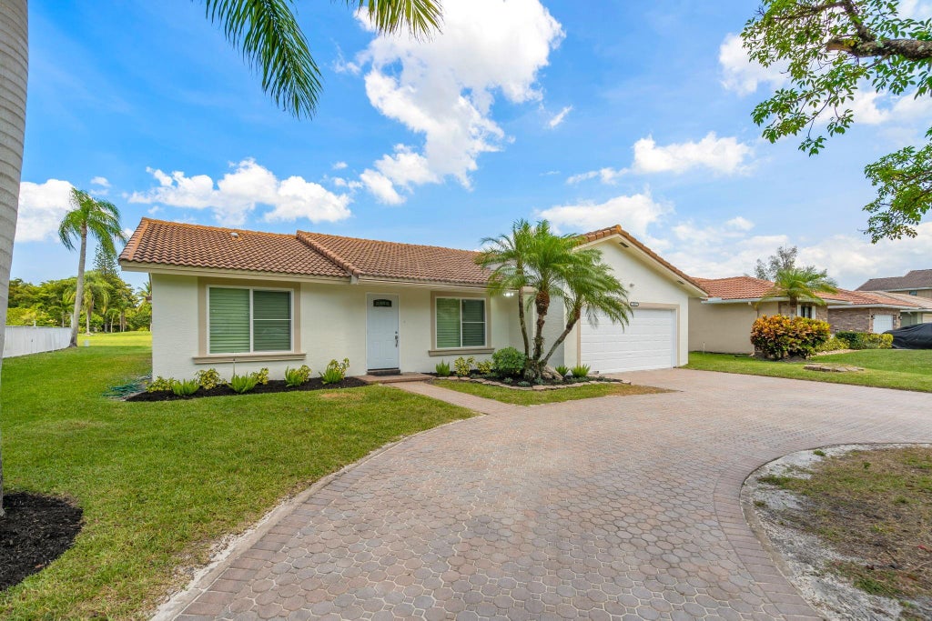 Photo of 1911 NW 107th Drive, Coral Springs, FL 33071 (MLS # F10524108)