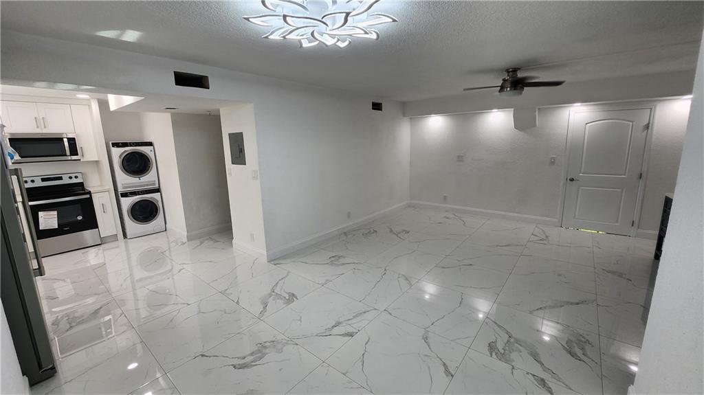 Quite neighborhood, close to shopping & transit. Fully updated with designer materials. Stainless appliances, dishwasher, garbage disposal. Stacked washer/dryer in unit and laundry on premises. Brand new hurricane windows. Nicest unit in the complex. Pool, tennis and gym. Assoc application needed; credit score above 600 & previous landlord referral. Section 8 OK with approved 3-bedroom voucher.