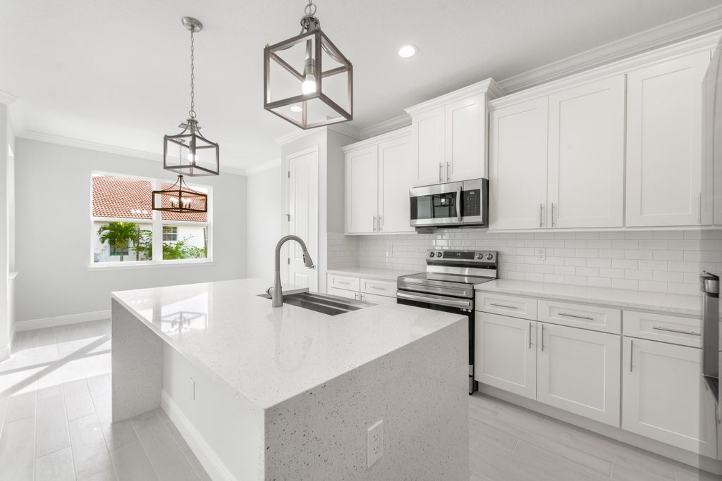 Photo of 4022 SW Carlile Street, Port Saint Lucie, FL 34953 (MLS # R11056126)