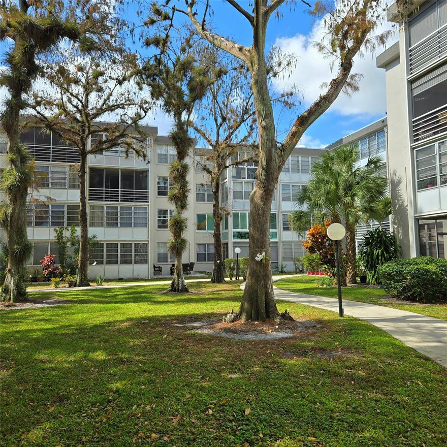 * HIDDEN GEM OF BROWARD COUNTY * PEACEFUL PARK-LIKE SETTING AMID COURTYARD STYLE BLDGS * COMMUNITY POOL, GRACEFUL TREES and WALKING PATHS * TOP FLOOR SEMI-UPDATED CONDO IN MOVE-IN CONDITION * Close to elevator, laundry room w/view of parking spot from your front door * Freshly painted with NO wallpaper & NO carpet * Private, spacious screened patio overlooking garden & treetops * Some updates including vanity in bathroom, flooring and NO plastic ceiling in kitchen * Water Heater 2022 * Reasonable monthly fee includes extended cable, reserves & more * Pick-up trucks permitted but only (1) vehicle/unit * 700+ credit score all buyers * No income requirement for cash buyers * Can rent seasonally w/no wait period upon purchase (3 month min & 6 months max Oct-April ONLY) *