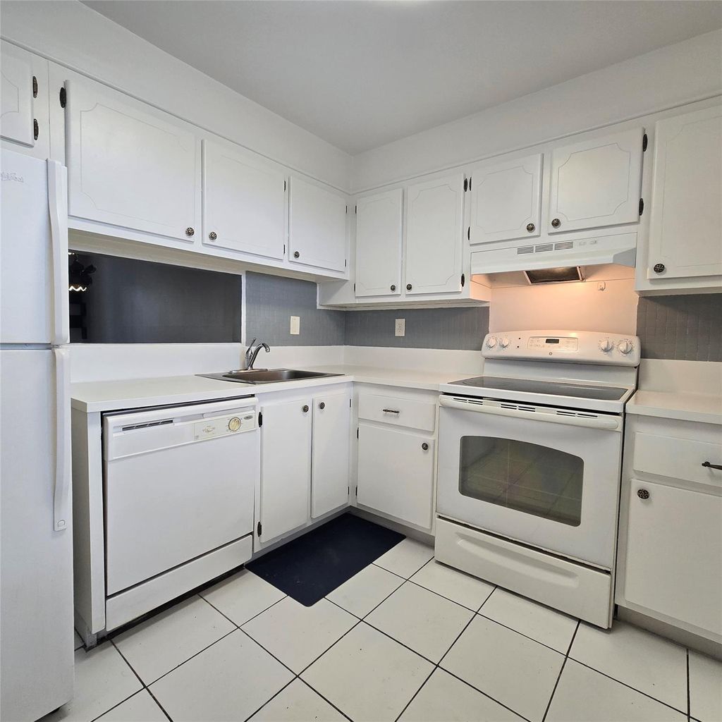 Photo of 4898 NW 29th Ct #412, Lauderdale Lakes, FL 33313 (MLS # F10537048)