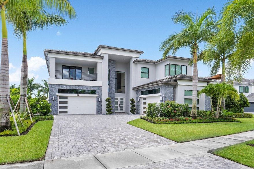 Beautiful Riverside Model only found in Boca Bridges, situated on one of the largest waterfront lots in the community! This property spans .54 acres, showcasing its private 30x50 sport court with pickle-ball lines and net, a 3-hole putting/chipping green, and a spectacular custom infinity pool and spa. The most popular floorplan with 5 bedrooms, 6.5 baths & over 5800 SF under air. The backyard is completely private and fully custom landscaped. The summer kitchen is equipped with a 42'' Alfresco grill, two fridges, & surround sound speakers. Enjoy a dog lover's paradise, the property is totally surrounded with pro toad fencing and luxurious turf. The house also comes complete with a brand new Generac full-house generator. Experience the convenience of this Control-4 smart home! This property features a camera security system, water purification, double washer/dryers on second floor and garages with custom cabinetry, garage AC, and two refrigerators in the garage. 

The entire perimeter is secure for pet owners as it is surrounded in 6'' deep frog fencing that goes 30'' high. Pets are welcomed. The completely turfed in backyard is a dog lovers paradise. The ground floor greets you with an open kitchen featuring a sizable eat-in island and equipped with top-of-the-line appliances, wine fridge and cooling drawers. The primary bathroom impresses with its generous size, housing a stand-alone bathtub and an expansive frameless glass shower. surround sound, not only indoors but also surrounding the pool and basketball court. The house boasts an extensive security system with 20 Meraki cameras strategically placed throughout the interior and exterior.

This dream home includes high-end lighting, ensuring an exquisite aesthetic throughout. Additional amenities include oversized four-car garages complete with refrigerators and brand new custom cabinets, air conditioning, and epoxy-coated floors. The laundry room offers brand new dual washers and dryers, catering to increased efficiency. 
Experience luxury here immediately.

Boca Bridges is an upscale, gated community that promises an unparalleled living experience. The centerpiece of this luxurious enclave is the magnificent 27,000 square-foot clubhouse, providing residents with access to a resort-style pool and a full-service gourmet restaurant and bar.

For those seeking an active lifestyle, there is a state-of-the-art fitness center, offering a range of exercise classes. The community has tennis courts, pickle-ball courts, both indoor and outdoor basketball facilities, and a card room.

Families can enjoy a kid's splash park, an outdoor pavilion for parties, a game room, and many kids' activities throughout the year.