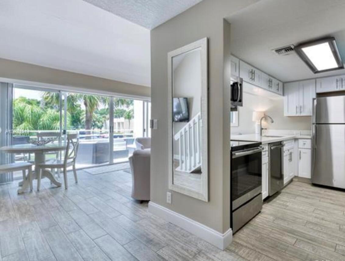 Fully furnished and just a short ways away from the beautiful turquoise waters of Jupiter Beach from this gorgeously renovated 2 bed, 2 bath, sunny and bright Poolside Villa at Jupiter Ocean Racquet Club. The first floor offers one guest bedroom, new ceramic wood look tile throughout, white shaker cabinets and quartz counter tops in the kitchen and bathroom and has a balcony off the living room and wet a bar. Second level includes the primary bedroom with ensuite bath, walk-in closet and washer / dryer. Pet friendly, 2 pools, clubhouse, tennis by membership... Come stay at the beach!