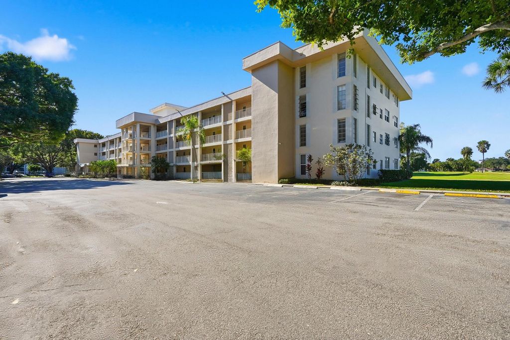 Photo of 2601 S Course Drive #202, Pompano Beach, FL 33069 (MLS # B26025680)