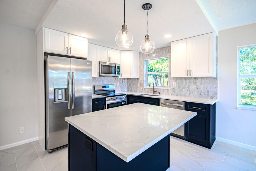 RAND NEW EVERYTHING. Completely redone condo from floors to ceiling. $18,000 was spent on impact windows and door in the back patio alone. Impact windows throughput the unit. Porcelain tile floors throughout, shaker cabinets in the kitchen and bathrooms. Quartz countertops and Marble backsplash crown the kitchen and give it the elegant modern look. Stainless steel appliances and gorgeous fixtures tie in the entire ensemble. Master bedroom was made bigger by replacing the sliders with a door. Corner unit with 3 extra windows and Central AC. Century village offers entertainment and socializing. A great Clubhouse with a pool, many activities and clubs to join, shuttle buses in the community and to locations outside & so much more. Minutes from Downtown West Palm Beach and freeways