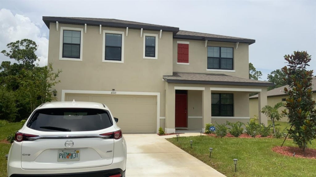 Photo of 6043 NW REGENT Street, Port Saint Lucie, FL 34983 (MLS # B26071757)