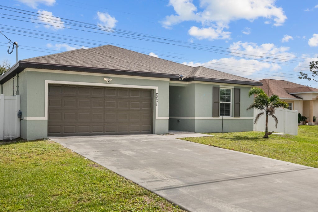 Photo of 2431 SW Brescia Street, Port Saint Lucie, FL 34953 (MLS # R10960338)
