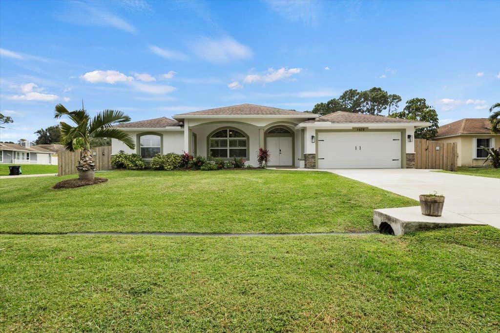 Photo of 1602 SW Glacador Avenue, Port Saint Lucie, FL 34953 (MLS # R11033480)
