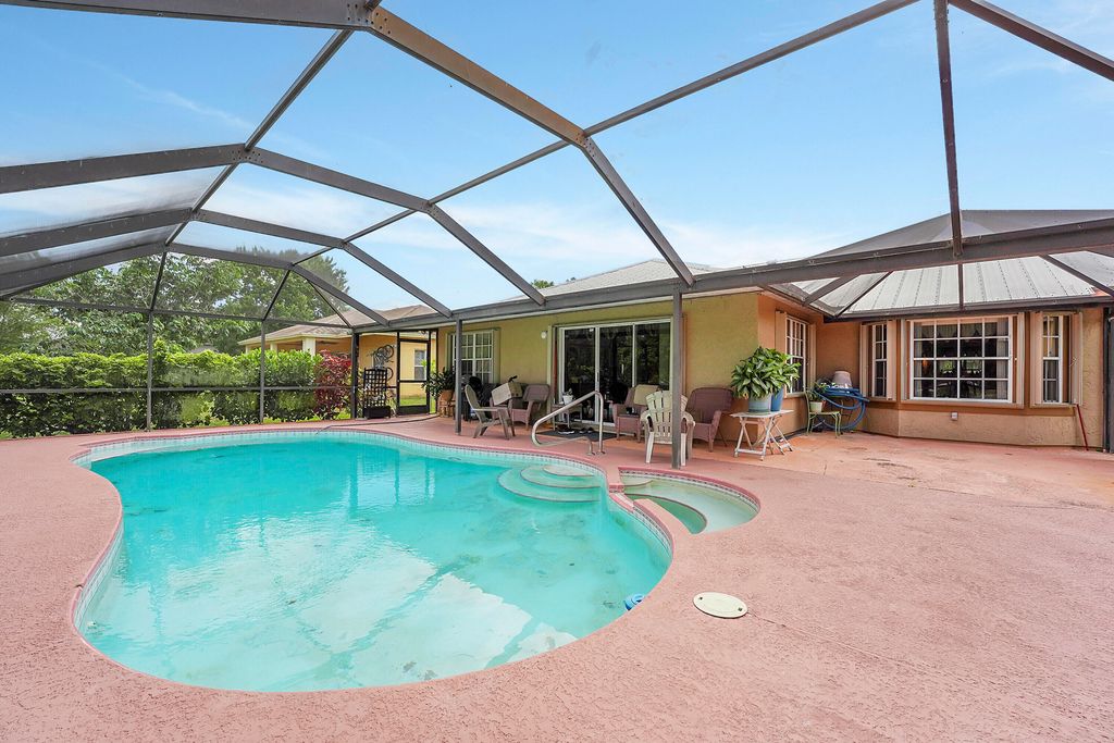 Photo of 6754 NW Argus Street, Port Saint Lucie, FL 34983 (MLS # R10984425)