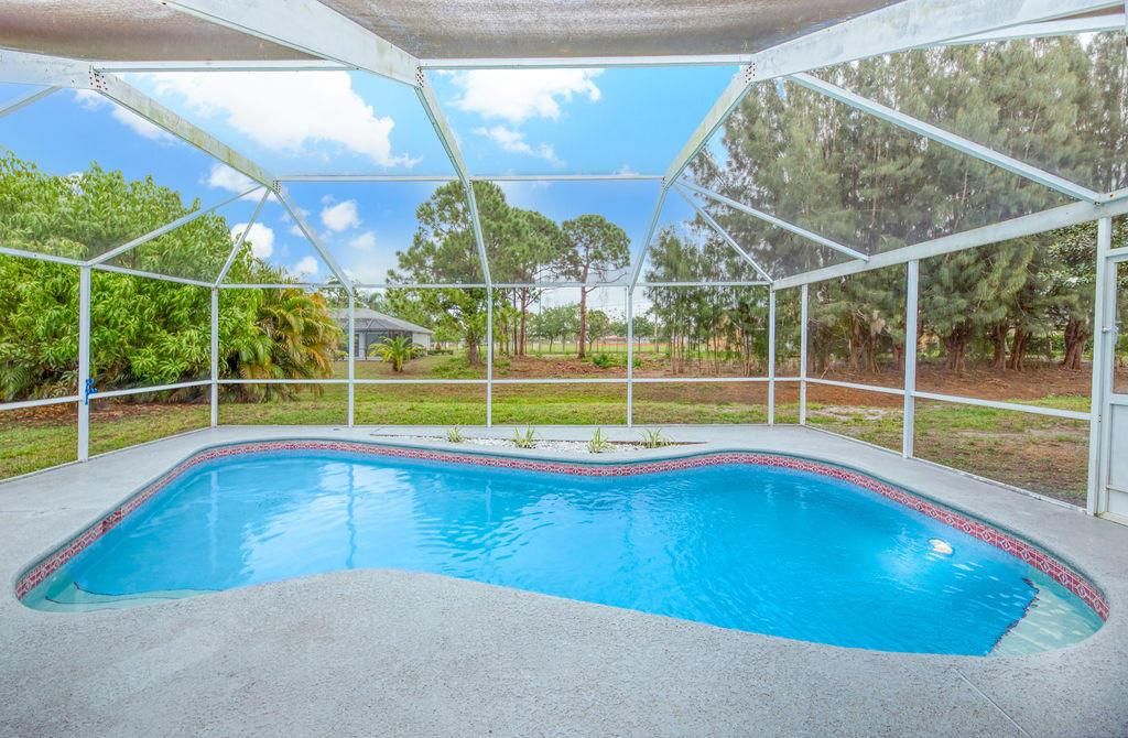 Photo of 3250 SE West Snow Road, Port Saint Lucie, FL 34984 (MLS # R10711398)