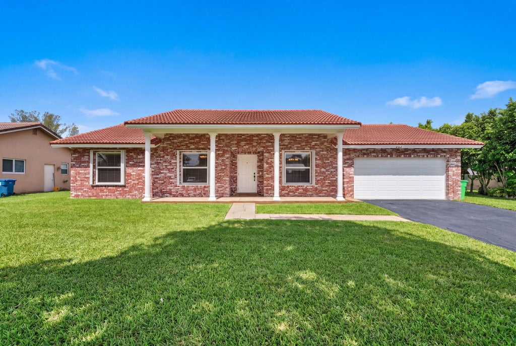Photo of 905 NW 133RD Avenue, Sunrise, FL 33325 (MLS # B26058641)