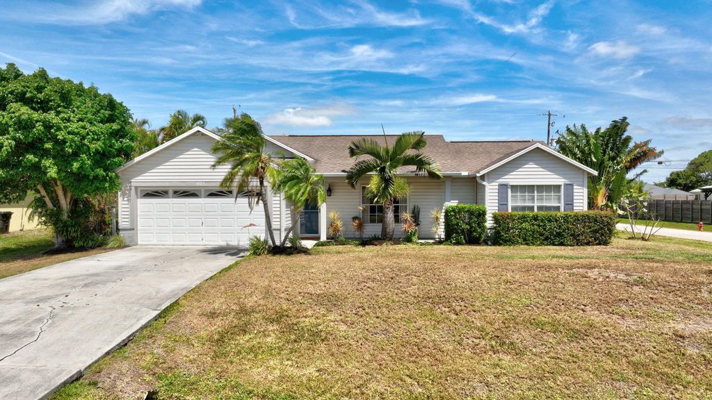 Photo of 405 SW Saginaw Avenue, Port Saint Lucie, FL 34953 (MLS # R10979944)