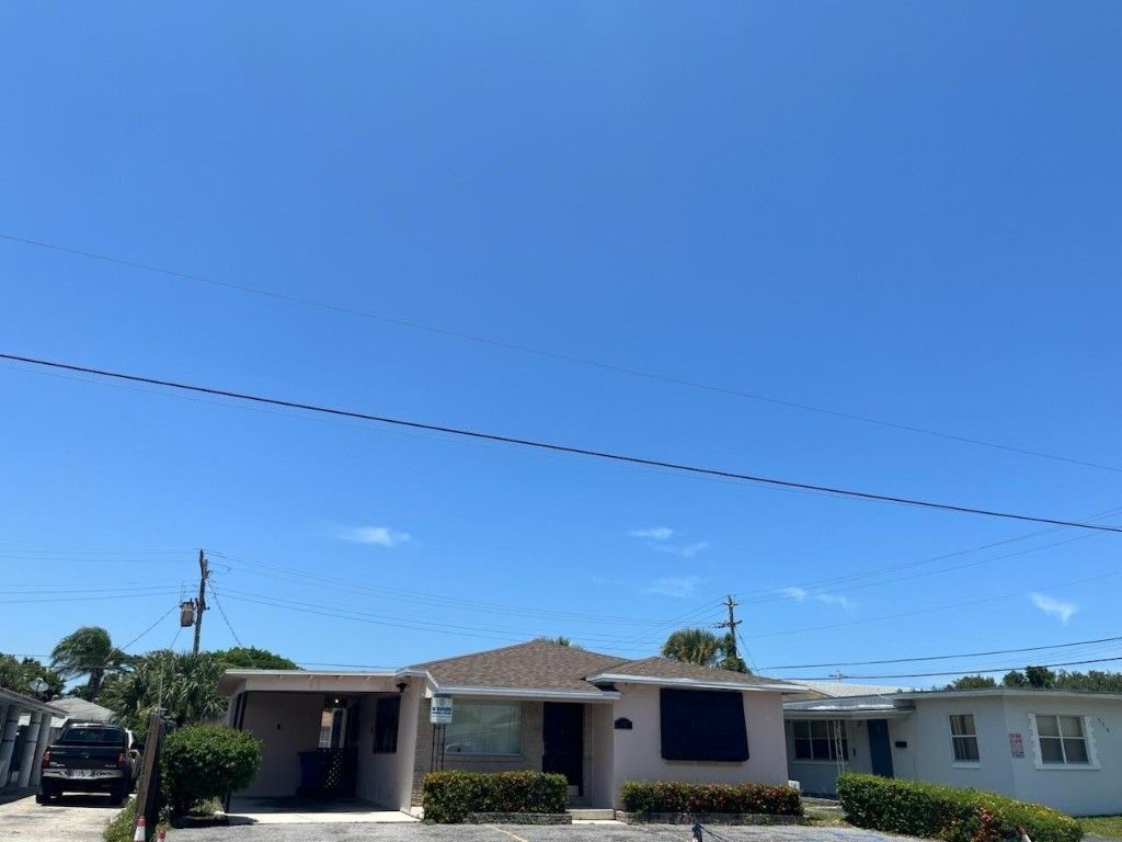 Photo of 126 W Blue Heron Boulevard, Riviera Beach, FL 33404 (MLS # F10548480)