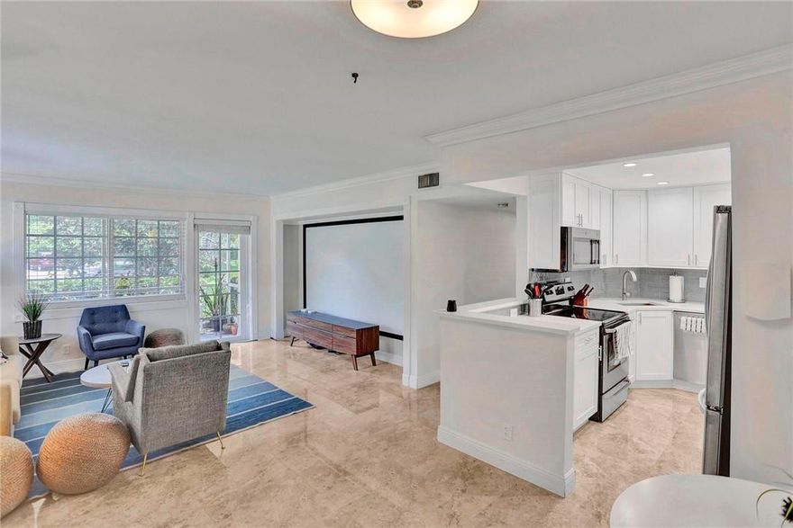 Beautifully updated condo, new kitchen with Quartz counter tops, Tile throughout, Corner unit with extra window in living room for extra light, NO land lease, Updated baths, Impact windows and door, Closest building to pool and clubhouse, just a few blocks to Wilton Drive with numerous restaurants, side walk cafes, shopping and nightlife. No leasing 1st year of ownership then rent limit of 10% and there is a waiting list, Cats only, washer and dryer are allowed to be installed. Separate required cable and internet is an extra $84.37 per month on top of maintenance fees. Phase 4 has tennis and pickleball courts, along with clubhouse with kitchen and heated community pool & sauna. Laundry facilities on same floor.