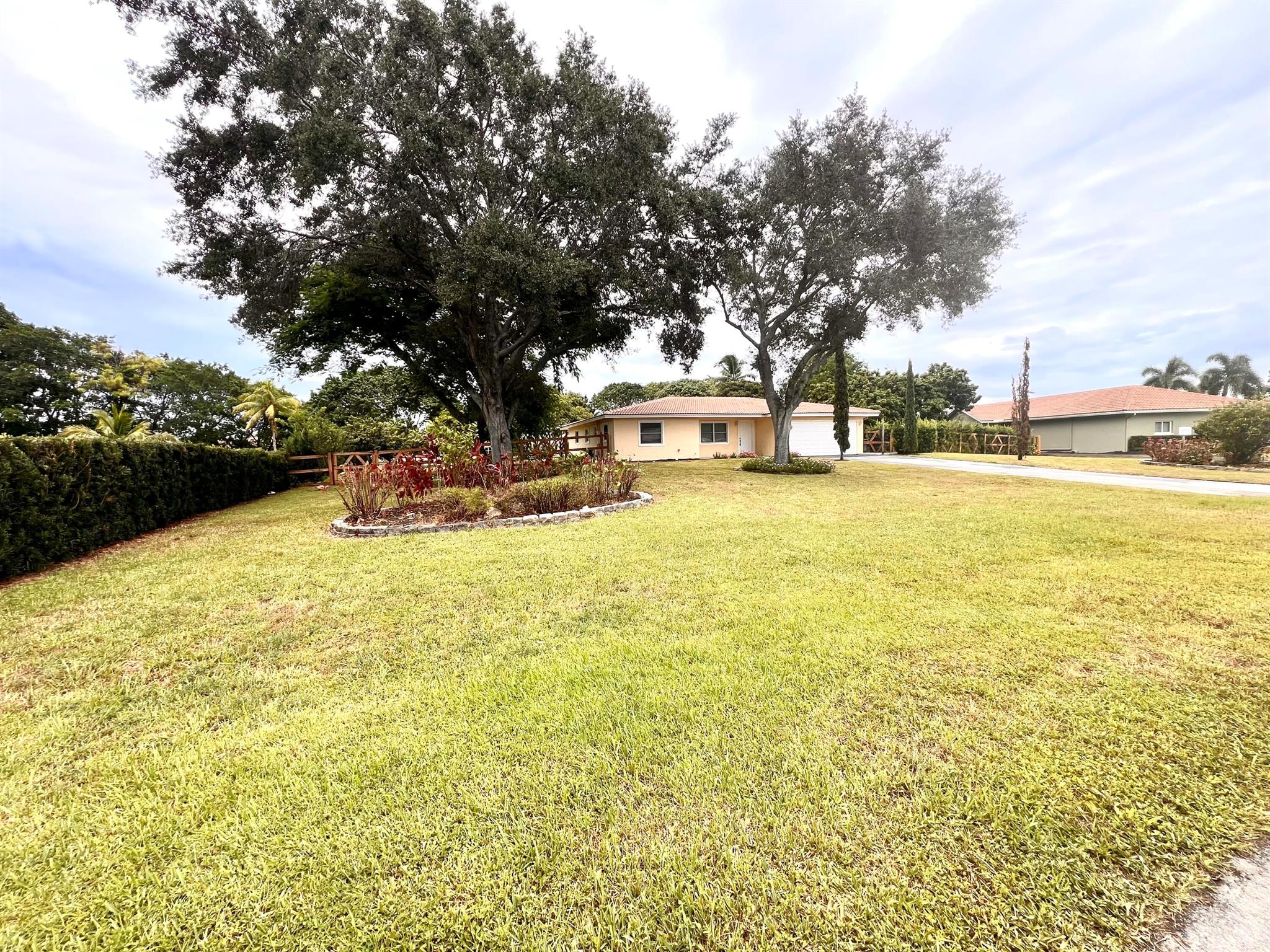 Experience lakefront living with this rarely available 4-bedroom, 3-bath home situated on a spacious 1-acre lot. Surrounded by nature and featuring beautiful fruit trees, this property offers a peaceful retreat with the convenience of a prime location. Inside, enjoy brand-new flooring, fresh paint throughout, and kitchen appliances in a thoughtfully updated interior. With serene lake views, it's perfect for relaxing or entertaining. Enjoy the community pool and tennis courts. This move-in-ready home combines comfort, space, and natural beauty, an exceptional rental opportunity that won't last long.