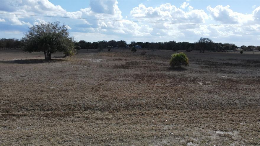 Beautiful 5 acres parcel located directly on private airstrip in established neighborhood. Oak trees on site. High and dry ready to build your new home.