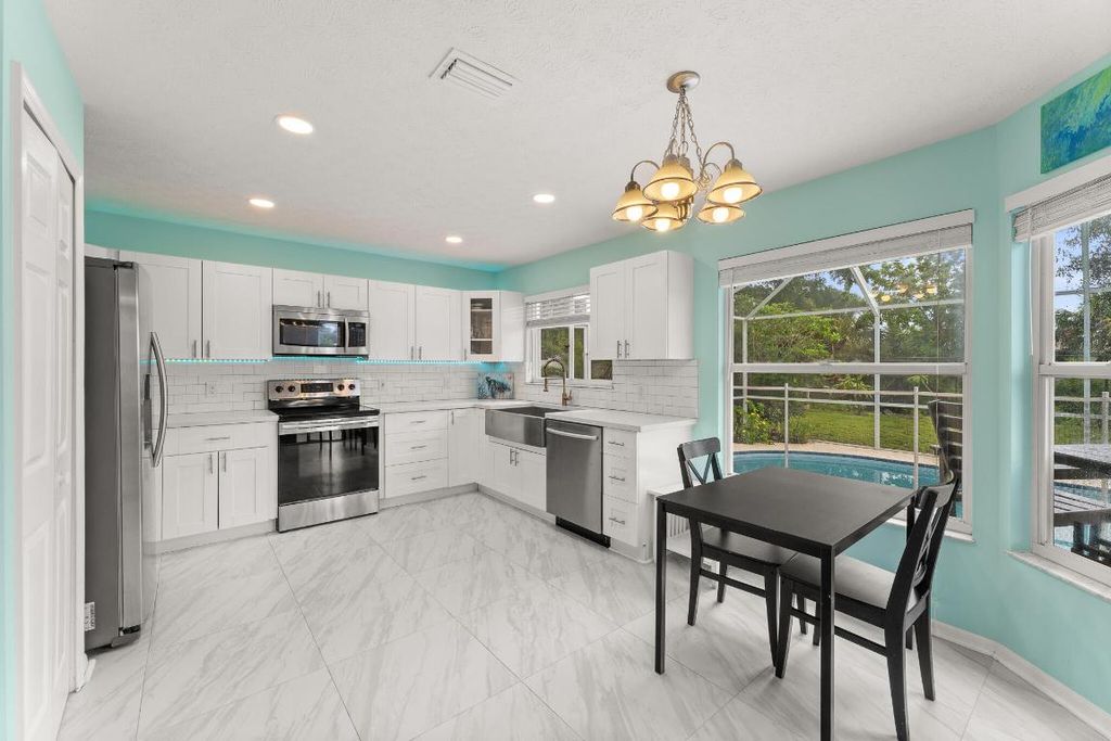 Photo of 590 SW Jeanne Avenue, Port Saint Lucie, FL 34953 (MLS # R11125105)