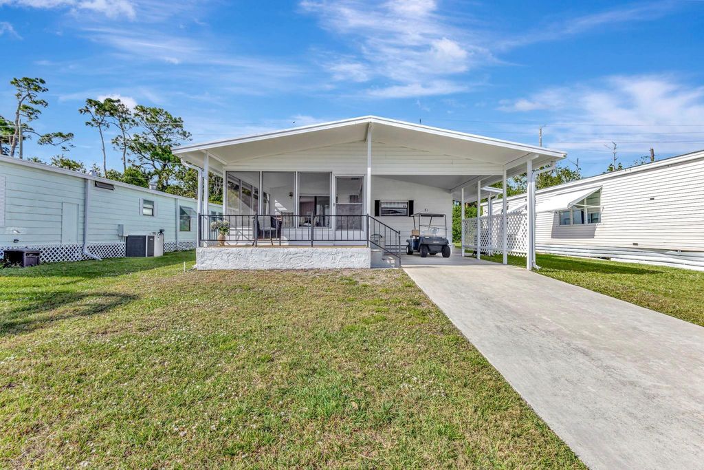 Photo of 31 La Puerta Del Norte, Fort Pierce, FL 34951 (MLS # F10539288)